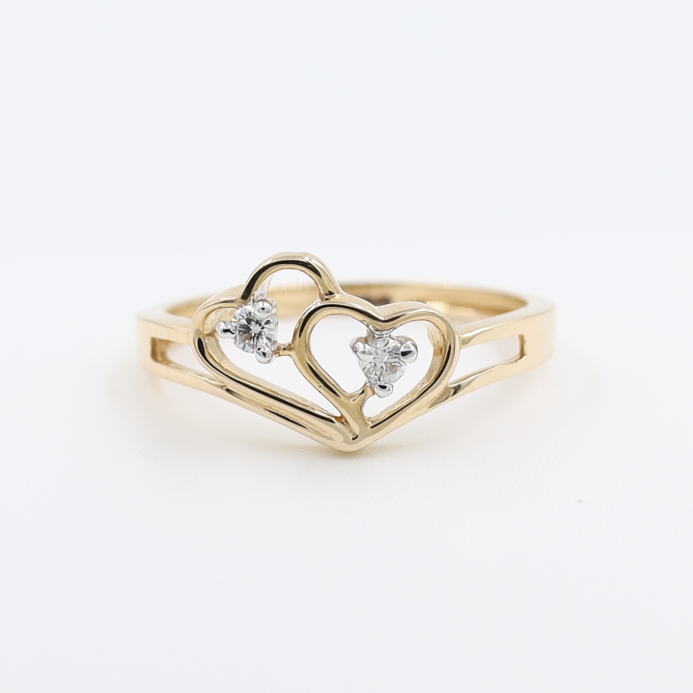 14Kt Rose Gold Ring In Shape Of Hearts With Two Diamond on It