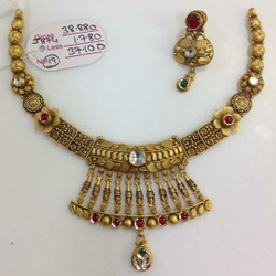 Gold Ladies Necklace Set by Sneh Ornaments
