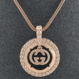 18kt gucci shaped rose gold  diamond pendant 