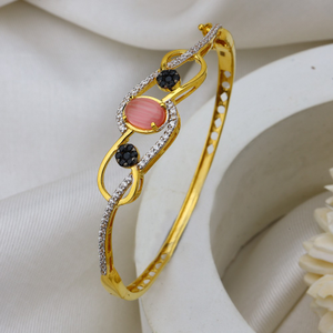 22k gold bracelet with delicate pink stone.