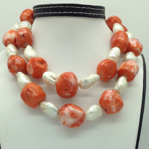 White oval baroque pearls with coral drums n