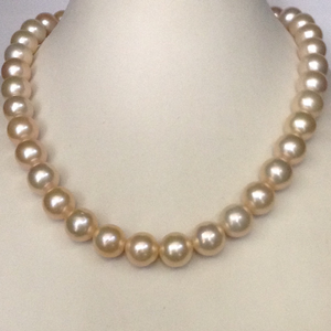 Freshwater orange round pearls strand JPM0104