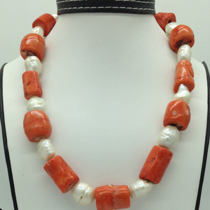 White oval baroque pearls with coral drums 
