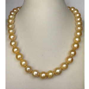 Freshwater golden round natural pearls strand
