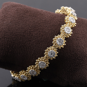 18kt yellow gold flower shaped diamond bangle