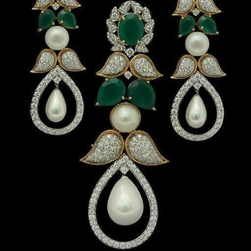 Gold earrings by V.S. Zaveri