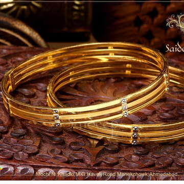 Gold enduring bangles by Saideep Jewels