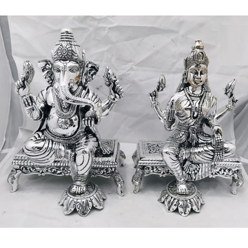 Pure Silver Idols of Lakshmi Ganesh On Singhasan P... by 