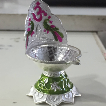 silver om and peacock designer fancy diya for dail... by 