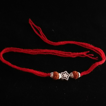 Silver Vertical rudraksh & star Broach rakhi by 