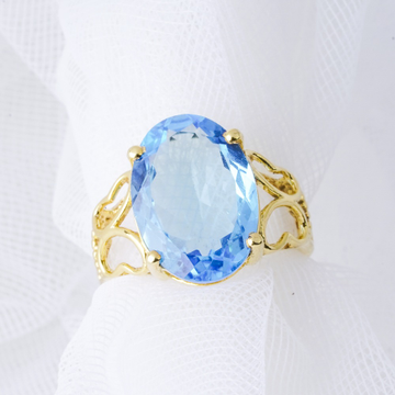 18kt yellow gold blue topaz ring by 