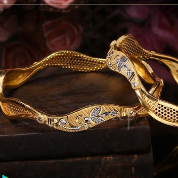 Gold dazzling bangles by Saideep Jewels