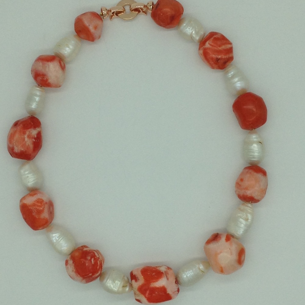 White oval baroque pearls with coral drums necklace jpm0387
