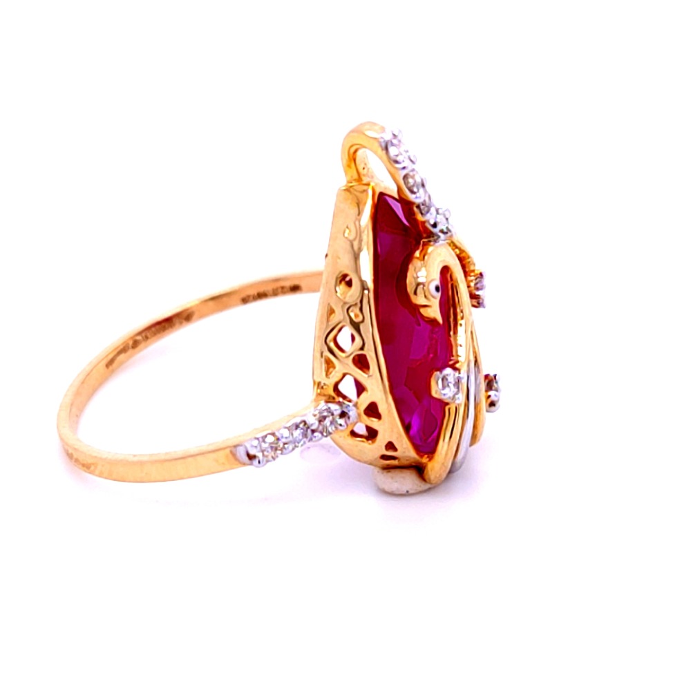 Mesmerizing peacock diamond ring in 14ktwith pink colored stone