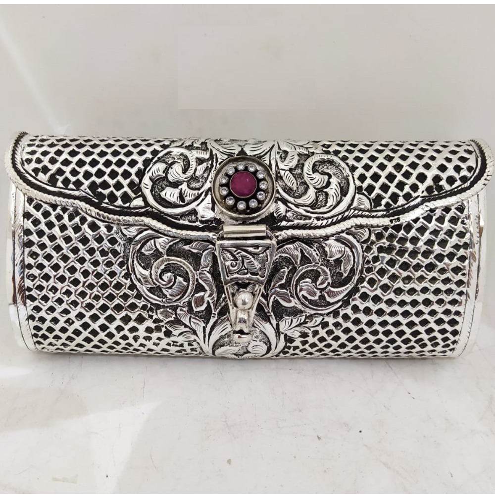 maanniya pure silver clutch in net motifs n gemstone