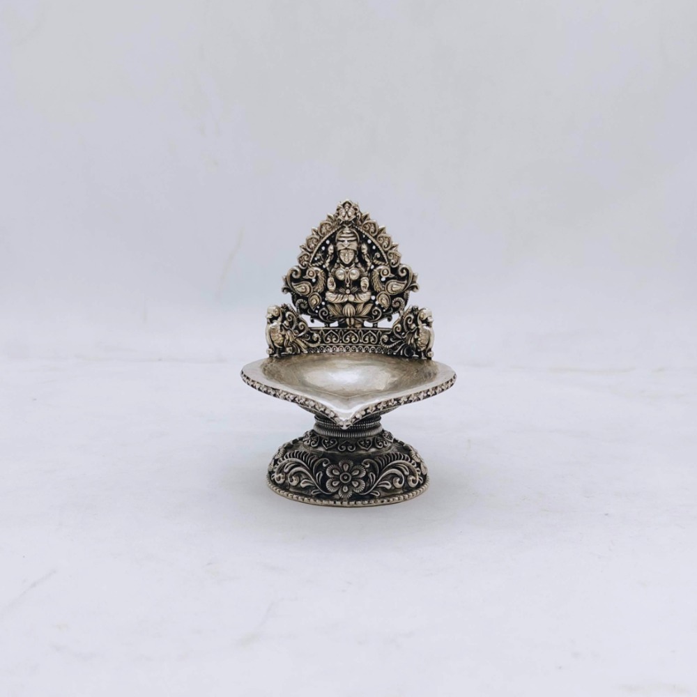 Hallmarked silver kamakshi lamp with peacocks in antique finish