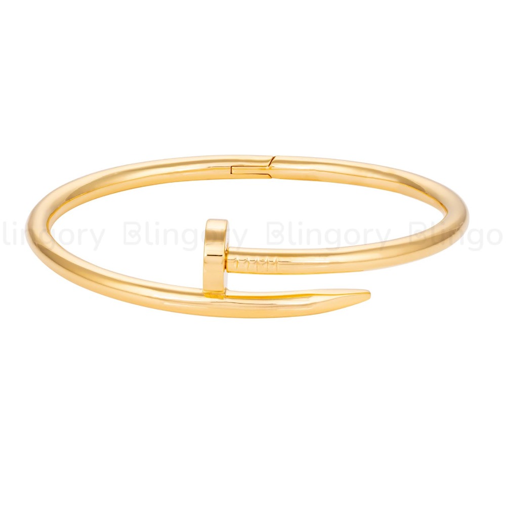 Nail bracelet 18k plain gold , 4mm thickness .