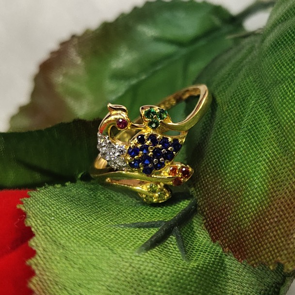 Vivid blues accentuate the handcrafted peacock ring in 22kt gold | Antique gold  rings, Gold bride jewelry, Gold rings fashion