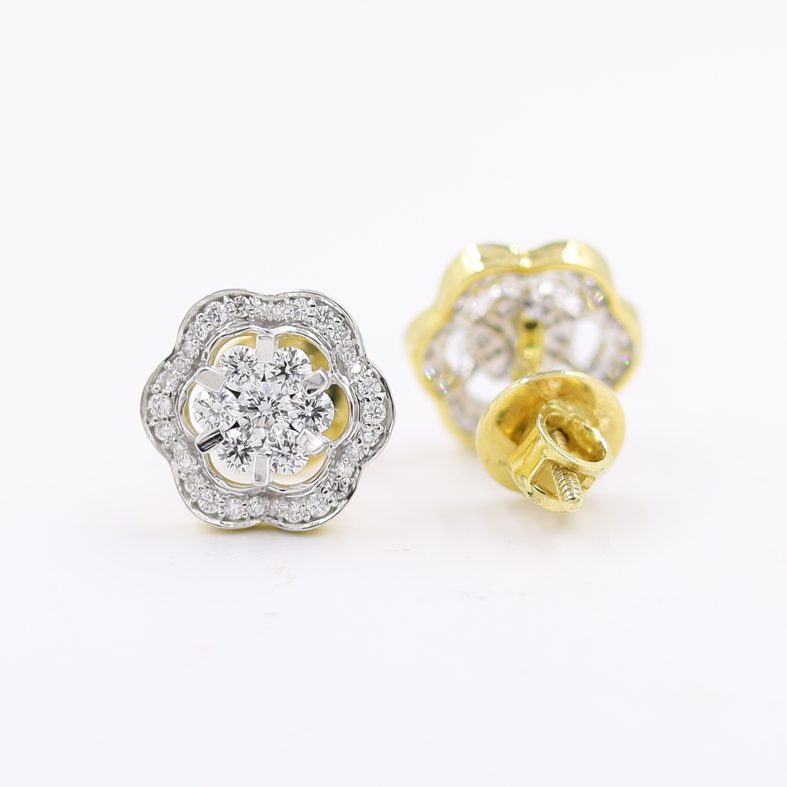 14kt Ethereal Floral Earrings topped with a round pressure-set diamond.