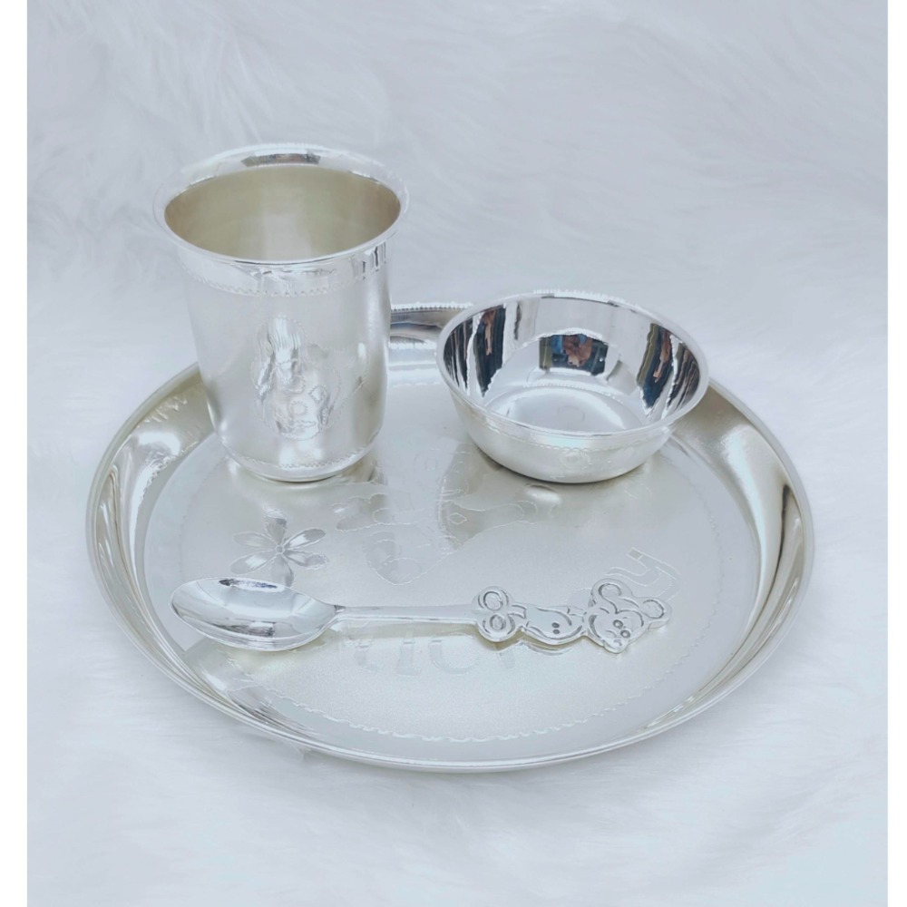 Hallmarked silver baby dinner set in fine mickey carving by puran