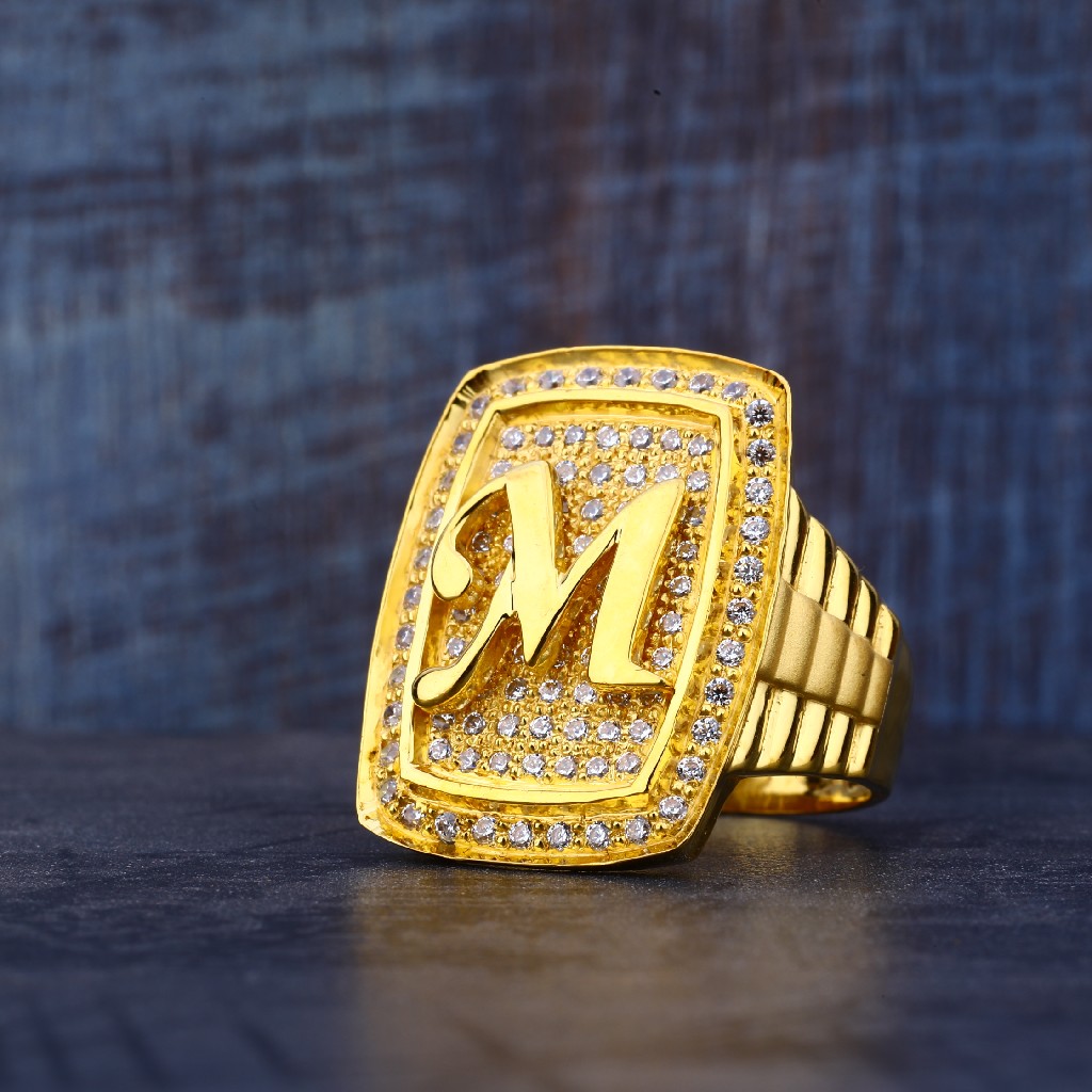 gold ring with m letter