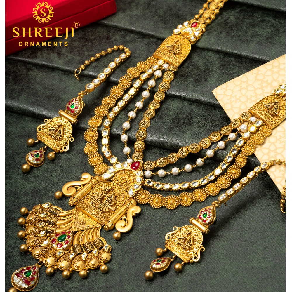 916 gold antique bridal look with radha-krishna pattern long set